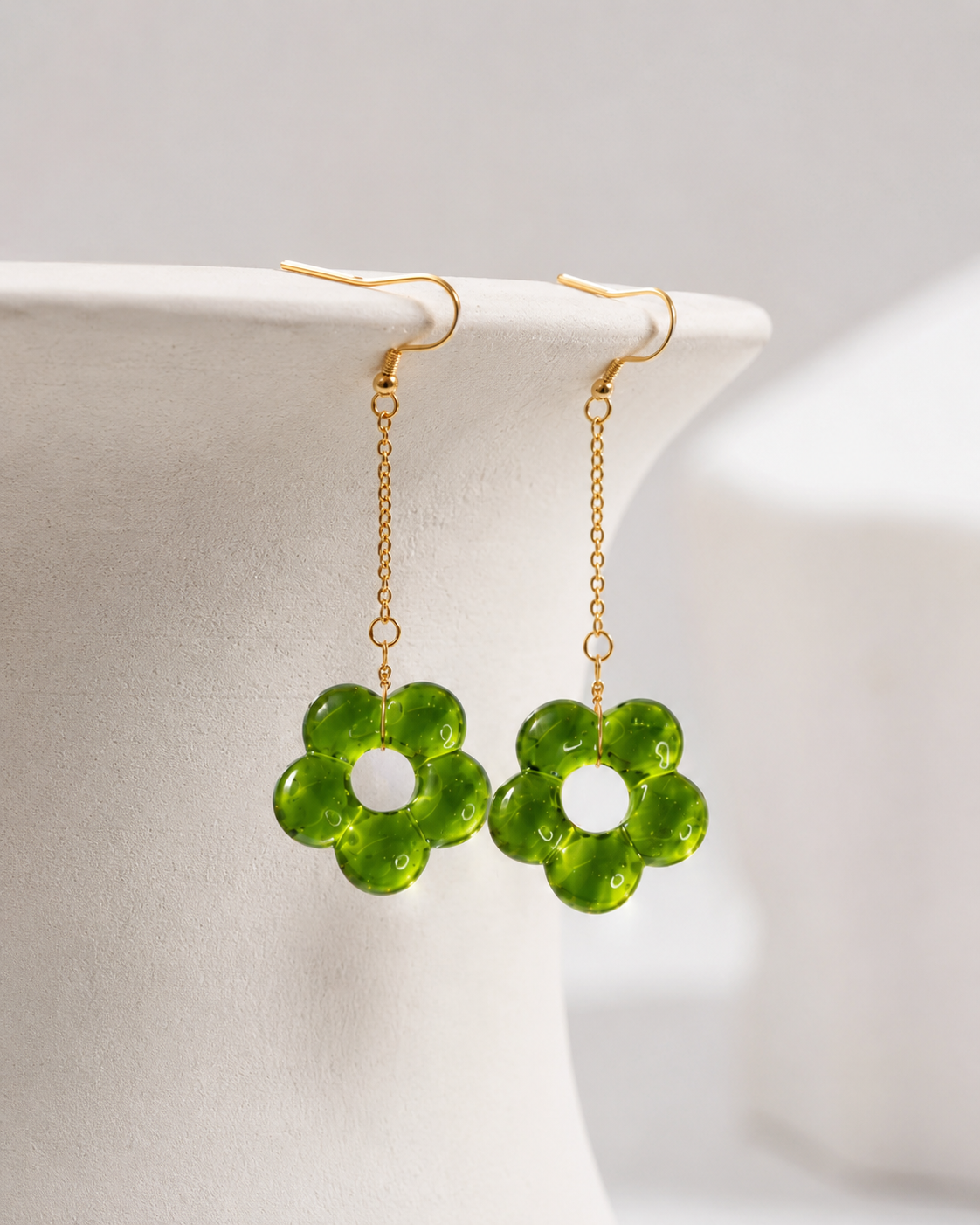 Green glass flower drop earrings on gold chains