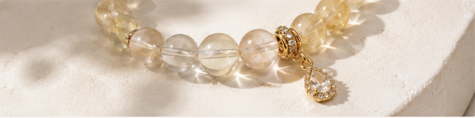 Citrine and clear quartz beaded bracelet with gold teardrop charm